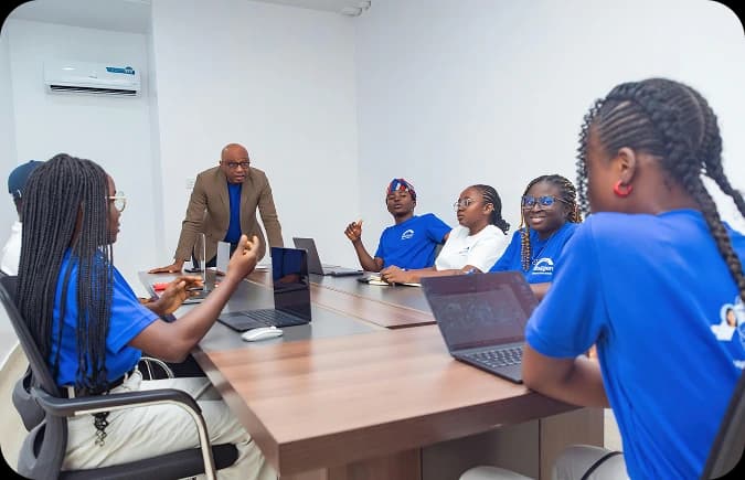SHEF programme participants in a training session with laptops