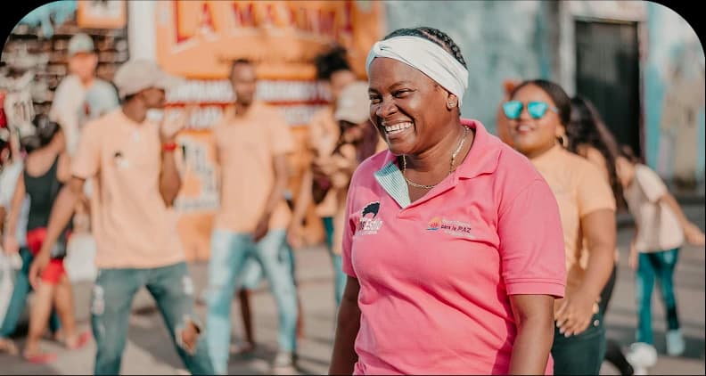 Woman smiling in a community empowerment programme