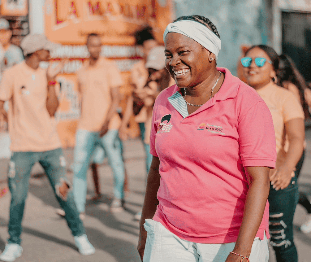 Woman smiling in a women empowerment programme